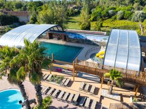 an overhead view of a pool at a resort at CAMPING & SPA CAP SOLEIL in Vias