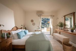 a bedroom with a large bed and a window at Istron Luxury Villas in Istro +142 photos