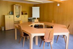 a dining room with a table and chairs at Berggasthaus Voralp in Grabs