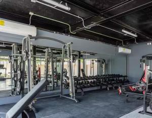 a gym with rows of tread machines at Alof Studio in the Jungle in Tulum