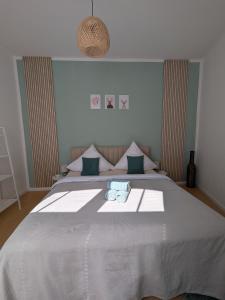 a bedroom with a bed with two towels on it at Appartement Napoleon in Meißen