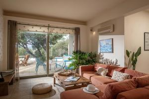 a living room with a couch and a table at Istron Luxury Villas in Istro