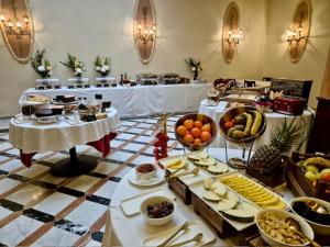 a buffet line with many different types of food at Hotel Nouvel in Barcelona