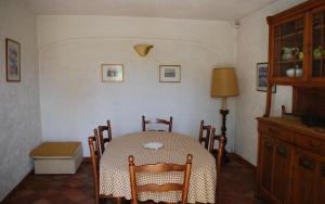 a dining room with a table and chairs in a room at Gîte dans les vignes la calade in Grimaud +9 photos
