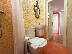 a bathroom with a toilet and a sink and a mirror at Beach House Victoria - Beachside - Playa Rincón in Rincón de la Victoria +37 photos