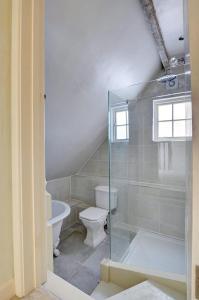 a bathroom with a toilet and a glass shower at 2 Bed in Tunbridge Wells oc-tw660 in Royal Tunbridge Wells +5 photos