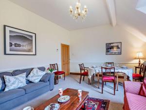a living room with a couch and a table at 3 Bed in Keswick oc-sz135 in Threlkeld