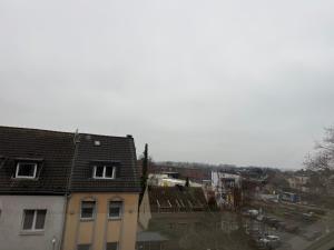 a view of a city with a building at Duren Bahnhof in Düren - Eifel