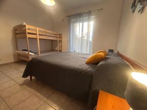 a bedroom with a bed and a bunk bed at villa Giò in Racalmuto