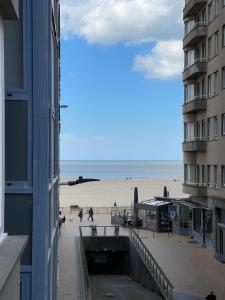 a view of a beach from a building at logies One Room, Sea view in Ostend +6 photos