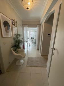 a hallway with a toilet and a plant in a room at logies One Room, Sea view in Ostend
