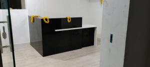 a room with a black and white wall with yellow bows at DJ Imperial Suites in Trivandrum