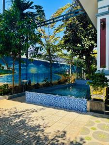 a swimming pool with a view of the water at Tiến Đạt Villa in Vung Tau