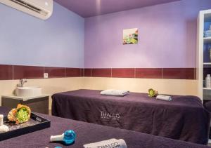 a massage room with a table and a sink at Camping Les Cigales - Aquatique Vacances in Le Muy