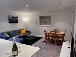 a living room with a couch and a table at A&A Resident - Modern North Vancouver 2BR Suite in North Vancouver