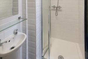 a bathroom with a shower and a sink at Lower Turks Head in Manchester +21 photos