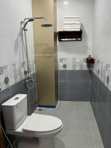 a bathroom with a toilet and a shower at Minh Minh Nam 3 Hotel in Can Tho +51 photos