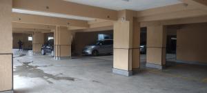 a parking lot with cars parked in a building at Kwetu properties in Nairobi