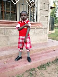 a young child standing on the steps of a house at Kwetu properties in Nairobi