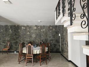 a dining room with a table and chairs at Heritage Villa colombo7 in Colombo