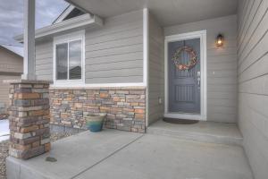 a front door of a house with a wreath on it at Rangeview Pass Pet Friendly with Epic Peak Views in Monument