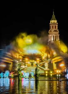 a building with a clock tower at night at Zenith Haven - Boutique Stay in Phú Quốc