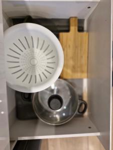 a white appliance sitting on top of a drawer at Central Platinum Apartments 14 in Rybnik