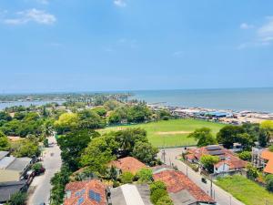 an aerial view of a city with the ocean at Liyasha Villa - AEONSKY in Negombo
