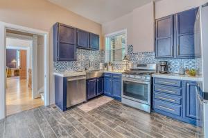 a kitchen with blue cabinets and blue appliances at The Rosemont Estate in Florence