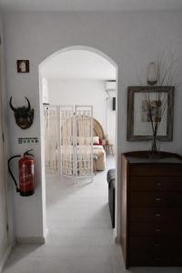 a living room with a fire extinguisher in a room at Estudio Boho Mar in Praia da Rocha