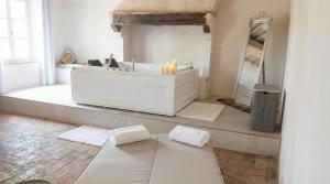 a bathroom with a sink and a tub with candles at Allegra Toscana - Affittacamere Guest house Arezzo in Arezzo