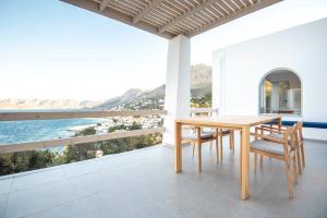 a dining room with a view of the ocean at Casa Mare Melitsahas - Panoramic Sea View in Kalymnos