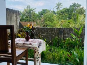 a table with a vase sitting on top of it at Kembang Kuning Cottages in Tetebatu +63 photos