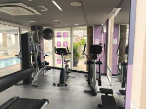 a gym with treadmills and elliptical machines at Airport Gru Flats in Guarulhos
