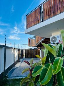an external view of a house with a balcony at Ekuku retreat in Oshakati