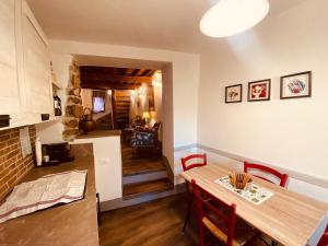 a kitchen and dining room with a table and chairs at La Torretta in Laterina +36 photos