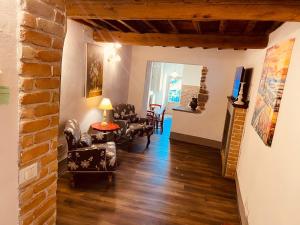 a living room with chairs and a table at La Torretta in Laterina