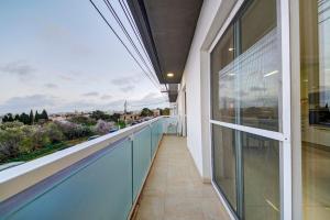 a balcony of a house with a view at Unique - Spacious 3BR Premium Flat in Is-Swieqi