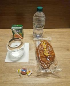 a bottle of water and a sandwich and a box of candy at RiVaLoVE in Nerviano