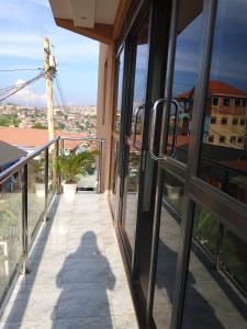 a balcony with a view of a windmill at Icon Hotel in Kampala