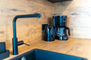 a coffee maker sitting on a counter top at NORDÉA Apartments in Rostock