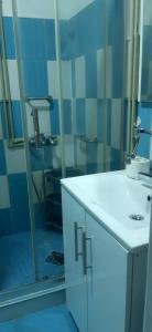 a bathroom with a white sink and a mirror at Villa Elena in Čiflik +23 photos