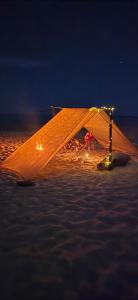 a tent in the middle of the ocean at night at Casa Laud Cuarto Guamuchil in Guayabas +2 photos