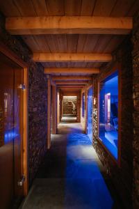 a hallway of a house with blue lights on the walls at Residence Hotel Miralago in Pergine Valsugana