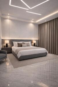 a bedroom with a large bed and a couch at Malaga palace in Soûr