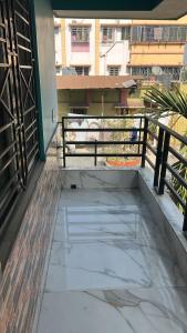 a balcony of a building with a fence at Apartment in Khardaha in Khardah