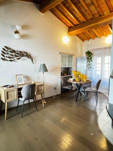 a dining room with a table and chairs at La Casa di Thor in Porto Azzurro +14 photos