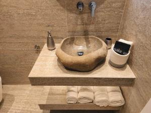 a bathroom with a large sink in a bathroom at Castle View Serenity Square in Koroni +18 photos