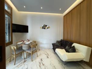 a living room with a couch and a table at Castle View Serenity Square in Koroni