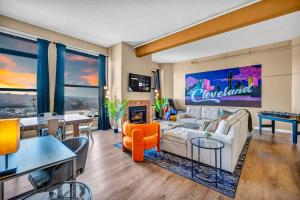a living room with a couch and a table at Fun 2Bed Apt Skeeball Foosball FREE Parking in Cleveland
